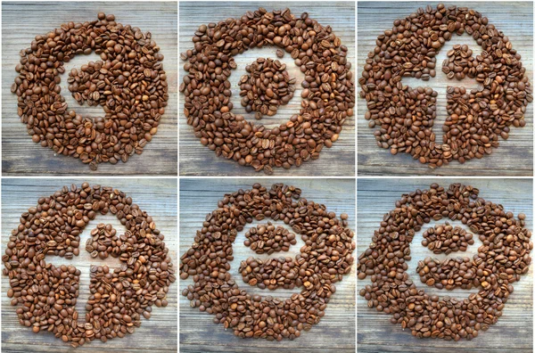 Word "coffee" written on coffee beans on a wooden table — Stock Photo, Image