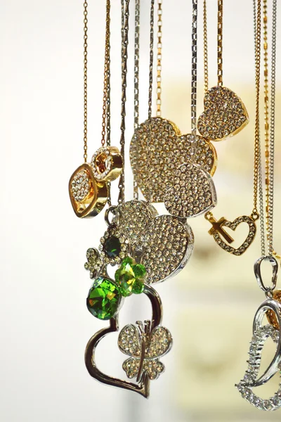 Beautiful golden necklaces with precious gems - diamonds — Stock Photo, Image