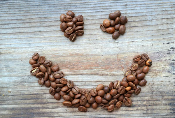 Visage souriant à base de grains de café — Photo