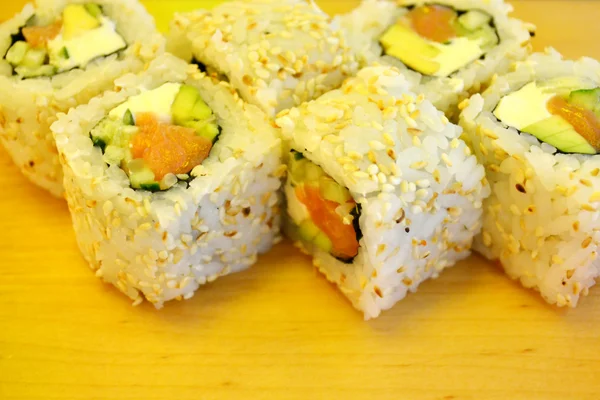 Delicious rolls and sushi with cucmber, salmon and philadelphia — Stock Photo, Image