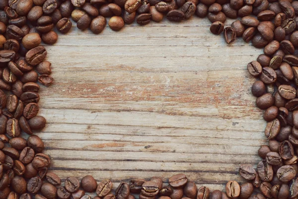 Frame made of lots of roasted coffee beans — Stock Photo, Image