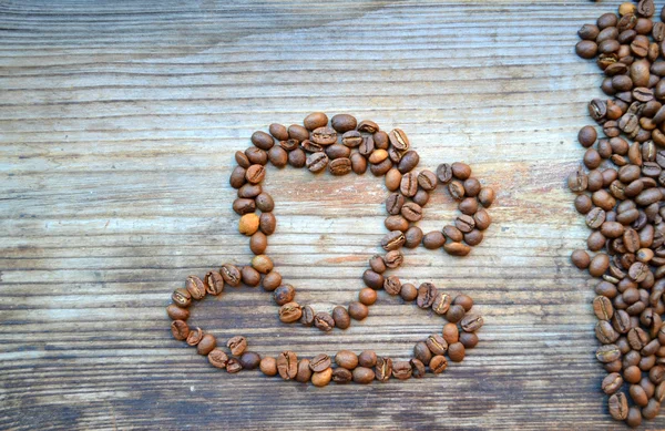 Taza o taza hecha de muchos granos de café tostados — Foto de Stock