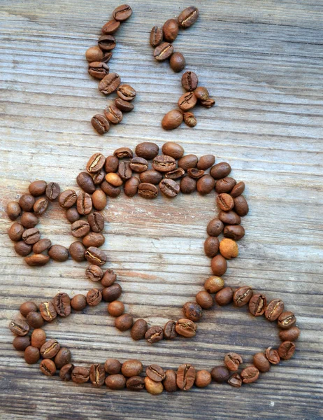 Tasse ou tasse faite de beaucoup de grains de café torréfiés — Photo