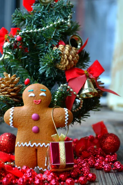 Holiday consept - Christmas tree and a cookie man made of ginger bread