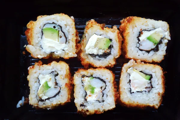 Delicious rolls and sushi with shrimp, cucumber and philadelphia — Stock Photo, Image