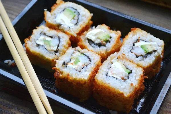 Delicious rolls and sushi with shrimp, cucumber and philadelphia — Stock Photo, Image