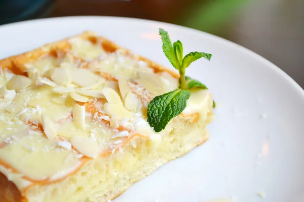 Belgian waffle with cream, coconut and mint — Stock Photo, Image