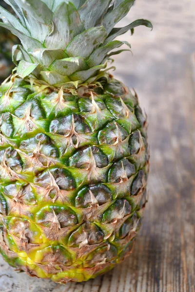 stock image Fresh pineapple on wooden table