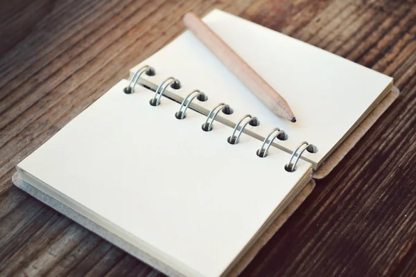 An empty retro notebook with old paper and little pencil — Stock Photo, Image