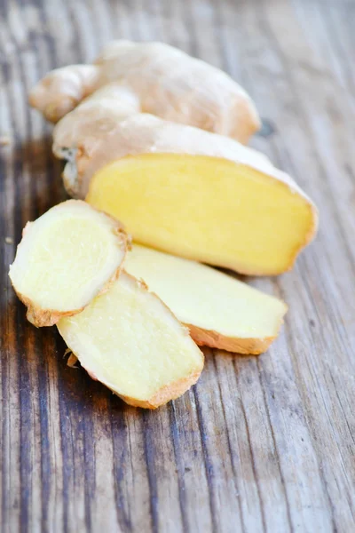 Ginger root on wooden table — Stock Photo, Image