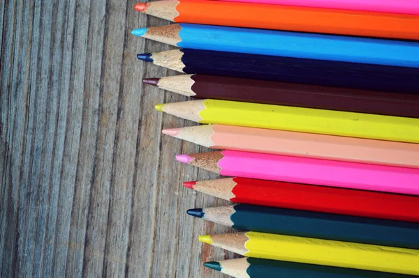 Set of colorful pencils on wooden table — Stock Photo, Image