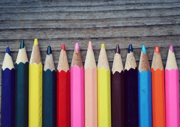 Set of colorful pencils on wooden table — Stock Photo, Image