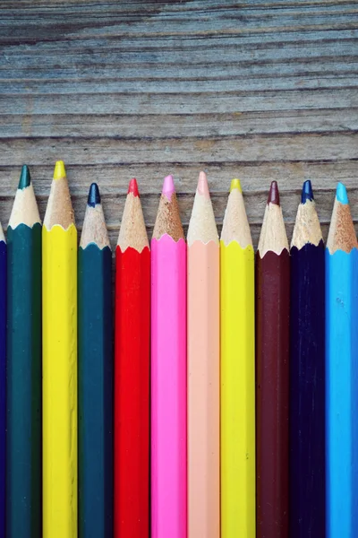 Set of colorful pencils on wooden table — Stock Photo, Image