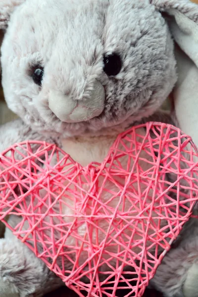Cute bunny toy with a pink heart — Stock Photo, Image