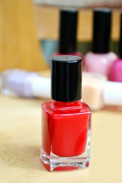 Uma garrafa de unha vermelha polonês closeup — Fotografia de Stock