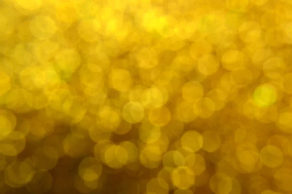 Bright and abstract blurred star golden background with shimmering glitter — Stock Photo, Image