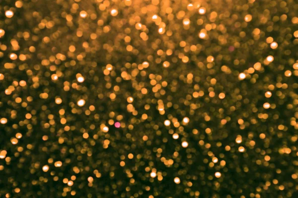 Brillante y abstracta estrella borrosa fondo dorado con brillo brillante —  Fotos de Stock