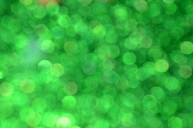 Parıldayan ile parlak ve soyut yeşil arka plan bulanık glitter