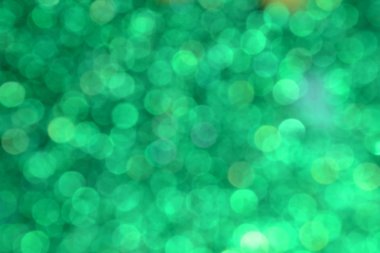 Parıldayan ile parlak ve soyut yeşil arka plan bulanık glitter