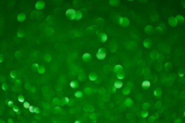 Parıldayan ile parlak ve soyut yeşil arka plan bulanık glitter