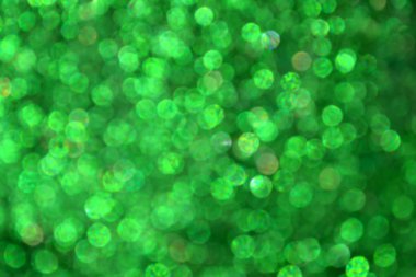 Parıldayan ile parlak ve soyut yeşil arka plan bulanık glitter