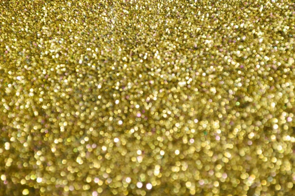 Bright and abstract blurred star golden background with shimmering glitter — Stock Photo, Image