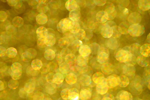 Lumineux et abstrait étoile floue fond doré avec des paillettes chatoyantes — Photo