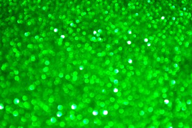 Parıldayan ile parlak ve soyut yeşil arka plan bulanık glitter