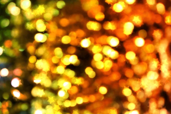 Helle und abstrakte verschwommene Sterne goldener Hintergrund mit schimmerndem Glitzern — Stockfoto