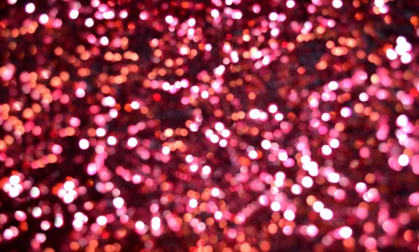 Jasny i streszczenie niewyraźne purpurowe tło z połyskujących świecidełka — Zdjęcie stockowe