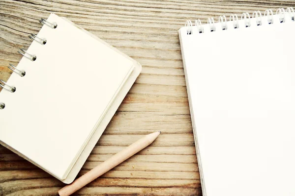 Two empty retro notebooks with old paper and a little pencil — Stock Photo, Image