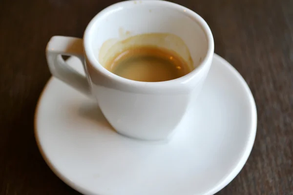 Small white cup of espresso coffee — Stock Photo, Image