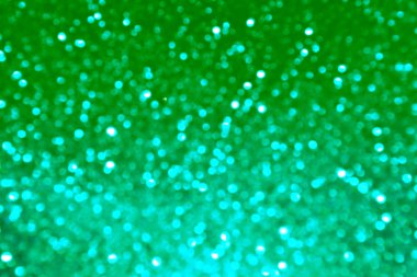 Parıldayan ile parlak ve soyut yeşil ve mavi arka plan bulanık glitter