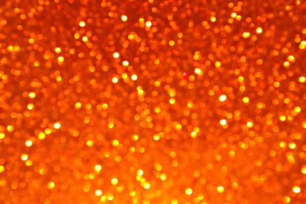 Bright and abstract blurred honey golden background with shimmering glitter — Stock Photo, Image