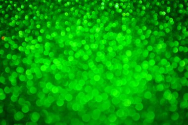 Parıldayan ile parlak ve soyut yeşil arka plan bulanık glitter