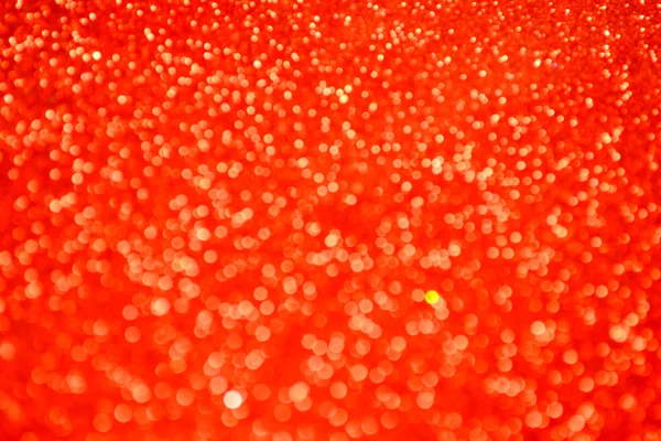 Bright and abstract blurred red background with shimmering glitter — Stock Photo, Image