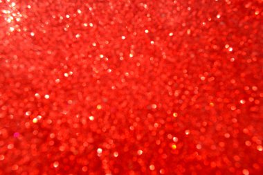 Parıldayan ile parlak ve soyut kırmızı arka plan bulanık glitter