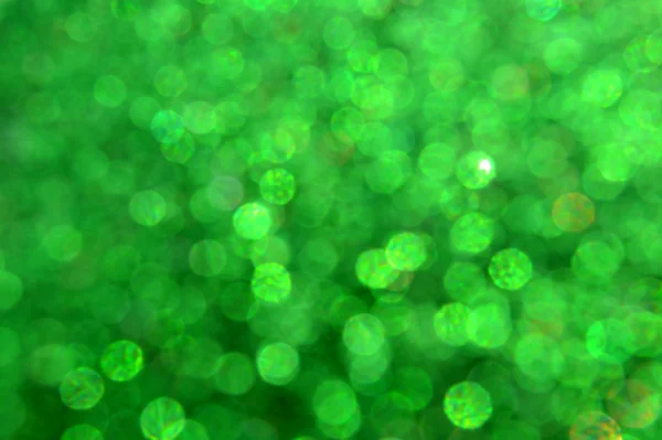 Ljusa och abstrakt suddiga grön bakgrund med skimrande glitter — Stockfoto
