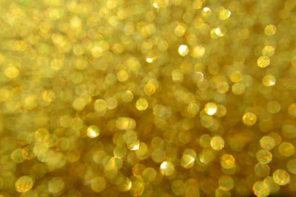 Helle und abstrakte verschwommene Sterne goldener Hintergrund mit schimmerndem Glitzern — Stockfoto