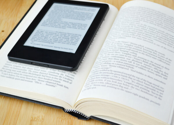 Book reader and an old fashioned book