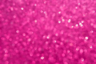 Parıldayan ile parlak ve soyut pembe arka plan bulanık glitter