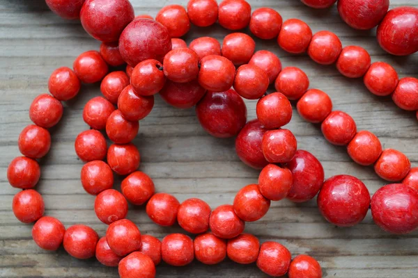 Traditional Ukrainian round red bead made from wood — Stock Photo, Image