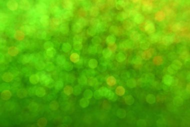 Parıldayan ile parlak ve soyut yeşil arka plan bulanık glitter