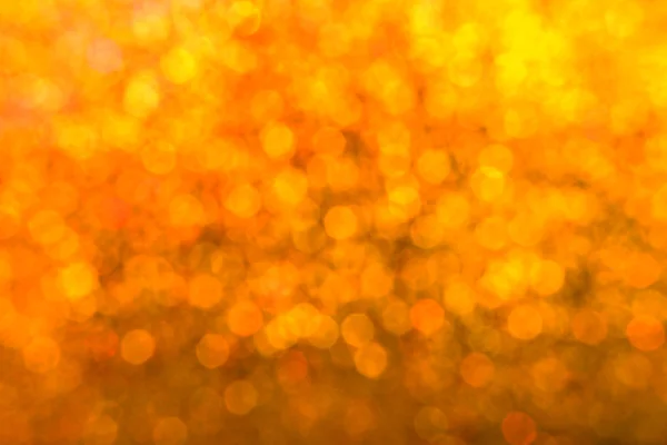 Helle und abstrakte verschwommene Sterne goldener Hintergrund mit schimmerndem Glitzern — Stockfoto