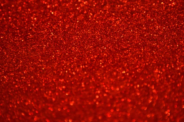 Bright and abstract blurred red background with shimmering glitter — Stock Photo, Image