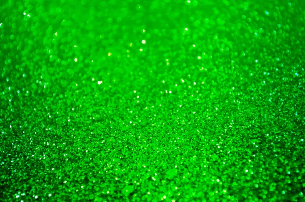 Bright and abstract blurred green background with shimmering glitter — Stock Photo, Image