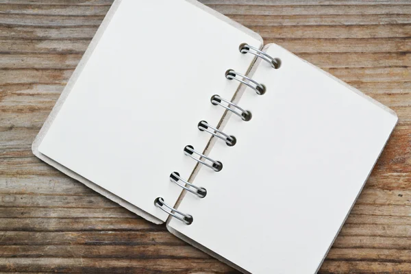 An empty retro spiral notebook with old paper — Stock Photo, Image