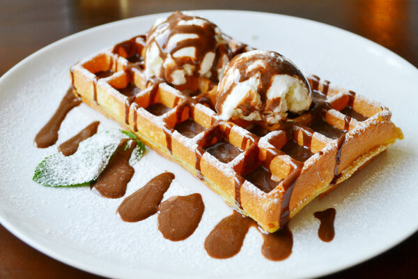 Belgian waffle with ice cream, chocolate and mint