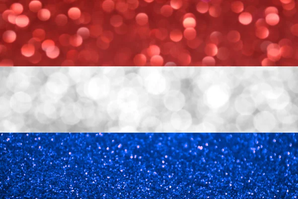 Bandeira nacional do Reino dos Países Baixos feita de fundos embaçados brilhantes e abstratos com brilho cintilante — Fotografia de Stock