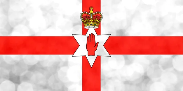 Flaga Ulster Banner, używane oficjalnie przez byłego rządu Irlandii Północnej wykonane z jasne i streszczenie tło niewyraźne z połyskujące świecidełka — Zdjęcie stockowe